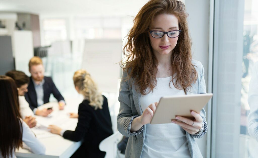 Elegant smart businesswoman in company office