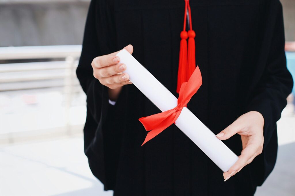 Graduate girl holding diploma