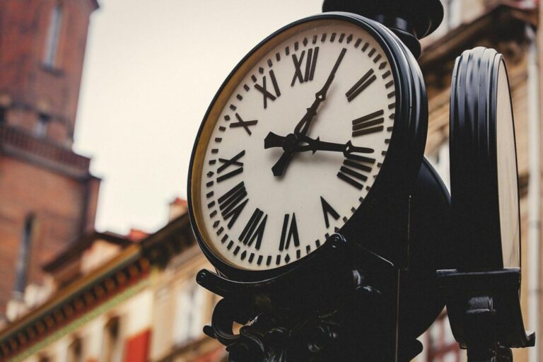 Street clock on a pole. Made in vintage style.