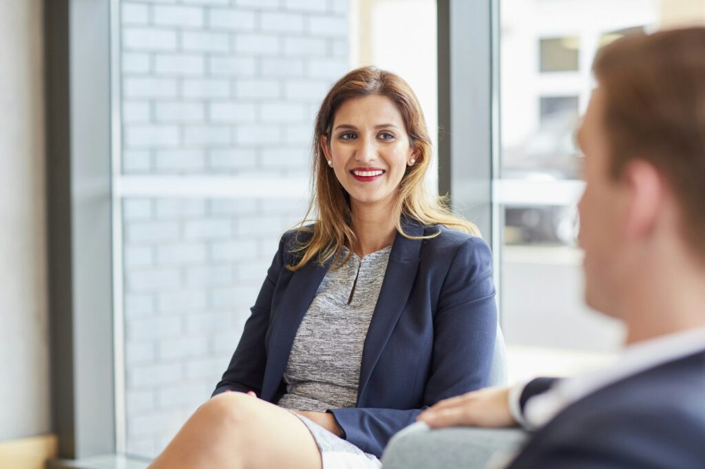 Businesswoman and businessman meeting in office