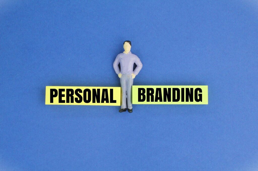 miniature people with words Personal Branding.