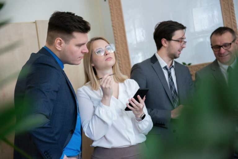 team of caucasian bussines people debating during a work meeting. Colleagues in serious discussions