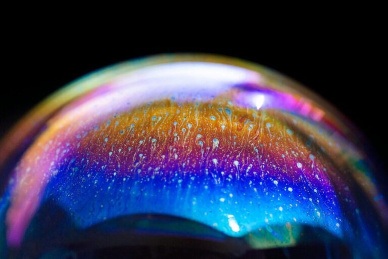 Multicolored rainbow in a bubble. Abstract texture inside of the soap bubble, macro photography.