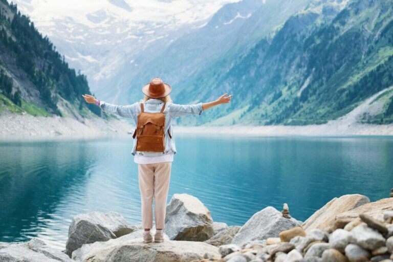 Traveler looks at the lake in Austria. Travel and tourism