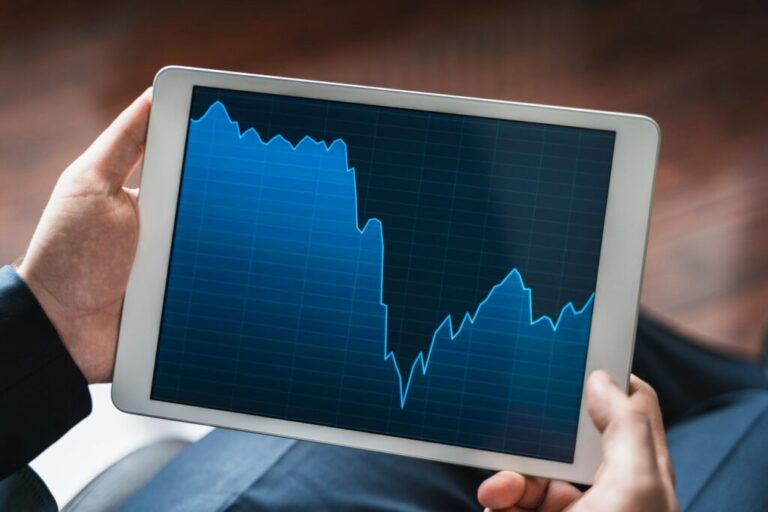 Businessman, investor,trader analyzing,looking at chart of stock prices in tablet. CEO,general manag