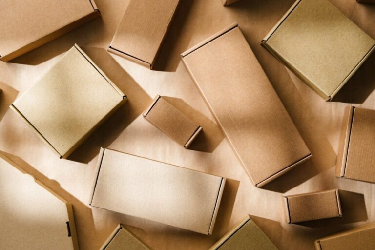 Multiple cardboard boxes arranged on a surface for packaging and shipping in a warehouse setting