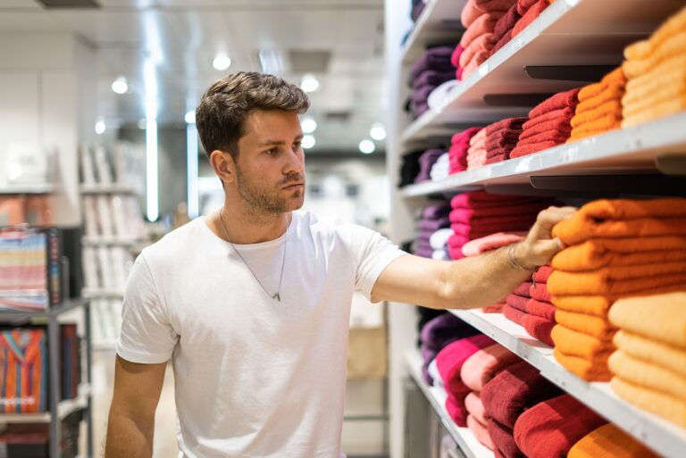 Buyer choosing towels in store