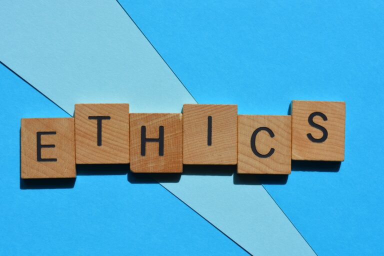 Ethics, word in wooden alphabet letters isolated on background as banner headline