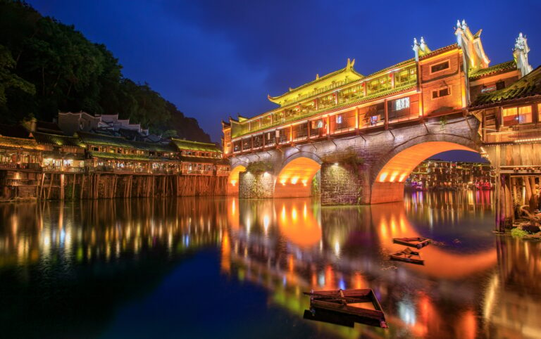 Hong bridge (Rainbow bridge) at night in Fenghuang old city ,Hunan Province, China