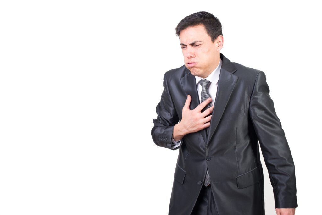 Man feeling ill and expressing pain in chest