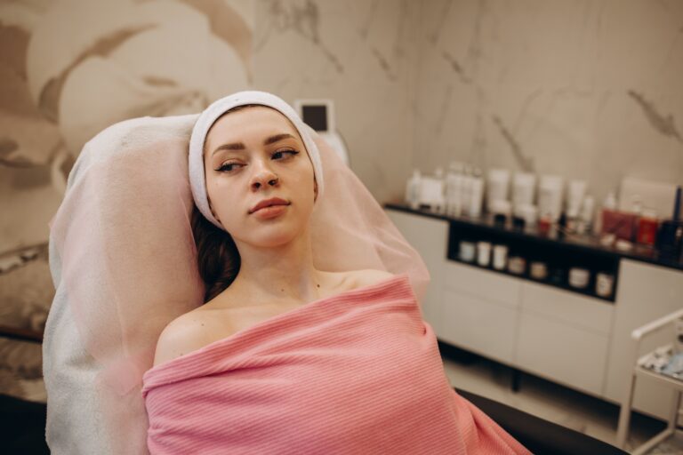 Young woman waiting for skin cosmetology cleansing procedure at beautician