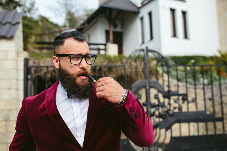 A rich man with a beard smokes cradle