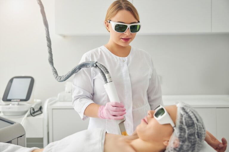 Calm young woman undergoing a cosmetic procedure